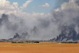 Smoke rises from Manbij city, Aleppo province, Syria June 8, 2016. REUTERS/Rodi Said