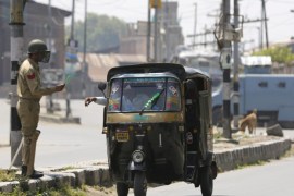 An Indian policeman stops a auto rickshaw during the implementation of restrictions in Srinagar, the summer capital of Indian Kashmir, India, 21 May 2016. Authorities imposed restrictions in the old quarters of Srinagar to supress a separatist rally commemorating the anniverssary of the deaths of the late religious leader Mirwaiz Mohammad Farooq and separatist leader Abdul Gani Lone. Both leaders were killed on the same day, 21 May 1990 and 2002 respectively. Shops, edu