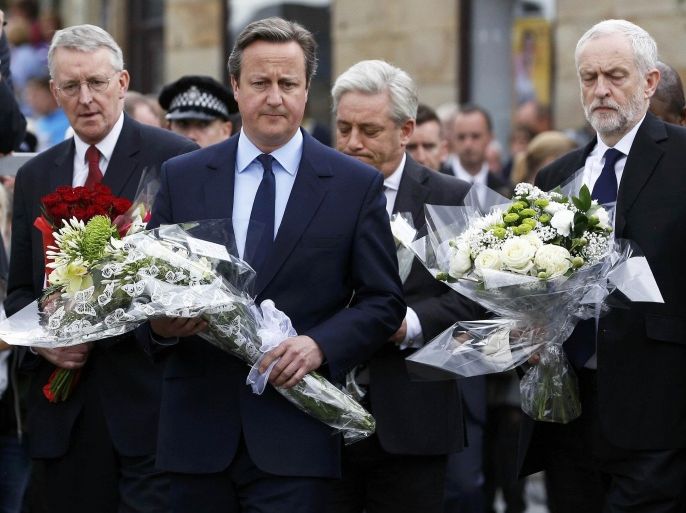 Britain's Prime Minister David Cameron (C) leads Labour Party leader Jeremy Corbyn (R), and Labour MP Hilary Benn as they pay tribute near the scene where Labour Member of Parliament Jo Cox was killed in Birstall near Leeds, in Britain June 17, 2016. REUTERS/Craig Brough