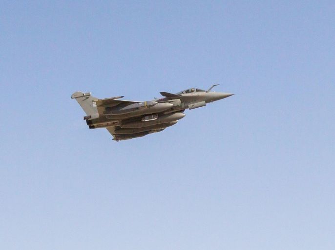 A French Rafale fighter jet, carrying cruise missiles, flies on a mission from an undisclosed base in the United Arab Emirates, December 15, 2015, in this photo distributed by ECPAD December 16, 2015. SCALP long-range missiles were launched on Tuesday from French fighter jets based in the United Arab Emirates and Jordan as part of a bombing raid that targeted a command center, training site and logistics depot in western Iraq on the border with Syria. REUTERS/ECPAD-French Defence Ministry/Handout via Reuters ATTENTION EDITORS - THIS IMAGE HAS BEEN SUPPLIED BY A THIRD PARTY. REUTERS IS UNABLE TO INDEPENDENTLY VERIFY THE AUTHENTICITY, CONTENT, LOCATION OR DATE OF THIS IMAGE. THIS PICTURE IS DISTRIBUTED, EXACTLY AS RECEIVED BY REUTERS, AS A SERVICE TO CLIENTS. FOR EDITORIAL USE ONLY. NOT FOR SALE FOR MARKETING OR ADVERTISING CAMPAIGNS. NO RESALES. NO ARCHIVE. IT IS DISTRIBUTED, EXACTLY AS RECEIVED BY REUTERS, AS A SERVICE TO CLIENTS