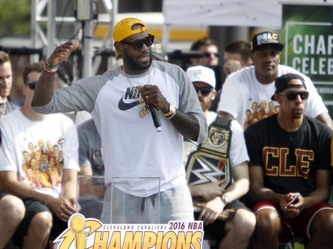 Cleveland Cavaliers forward LeBron James (C) speaks during the Cleveland Cavaliers NBA Championship Parade and Rally in downtown Cleveland, Ohio, USA, 22 June 2016. The Cleveland Cavaliers defeated the Golden State Warriors in game 7 of the NBA Finals to be crowned the 2016 NBA champions.