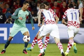 Football Soccer - Croatia v Portugal - EURO 2016 - Round of 16 - Stade Bollaert-Delelis, Lens, France - 25/6/16 Portugal's Cristiano Ronaldo in action with Croatia's Darijo Srna (R) REUTERS/Charles Platiau Livepic