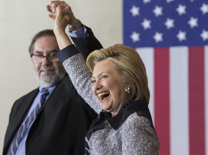 US Democratic presidential candidate Hillary Clinton (R) is introduced by President of United Steelworkers International Leo Gerard (L) at a campaign event in Pittsburgh, Pennsylvania, USA, 14 June 2016. Clinton criticized Republican presidential candidate Donald Trump's response to the 12 June mass shooting in Orlando, Florida.
