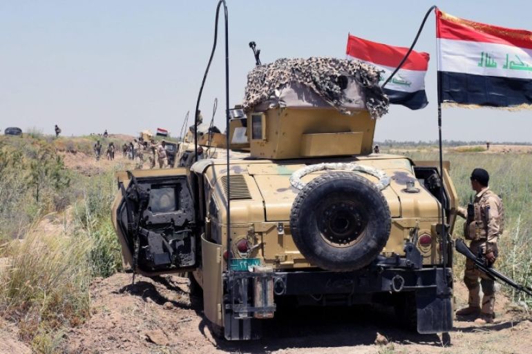 Iraqi military trucks take up position during a military operation southwest of Fallujah city, western Iraq on 25 May 2016. The Iraqi Army on 23 May began an offensive to take back the city of Fallujah, located around 50 kilometers east of Baghdad in the western province of Al Anbar, from the hands of the Islamic State (IS).