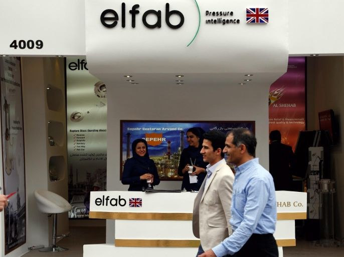 People walk past the 'elfab' company partition at the 21st Iran Oil, Gas and Petrochemical International Exhibition in Tehran, Iran, 05 May 2016. Elfab is specialized in designing, testing and consultancy services for pressure management. Media reported that around 1,900 companies, 900 from Iran and 880 from 38 countries, are showcasing their latest achievements in the exhibition running until 08 May.