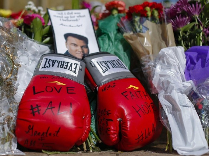 A remembrance left at a growing makeshift memorial in the plaza of the Muhammad Ali Center in Louisville, Kentucky, USA, 05 June 2016. Born Cassius Clay, boxing legend Muhammad Ali, dubbed as 'The Greatest,' died on 03 June 2016 in Phoenix, Arizona, USA, at the age of 74, a family spokesman said. A public funeral procession and memorial service will be conducted 10 June 2016 in Louisville.