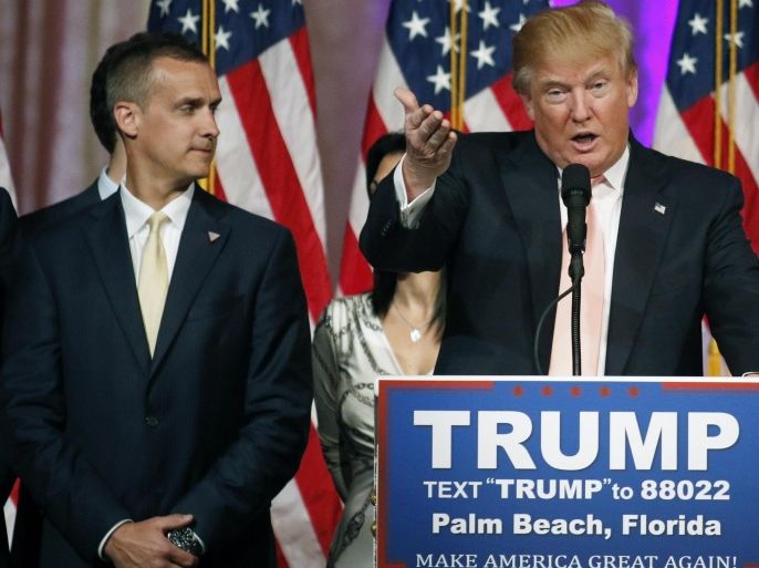 Campaign manager Corey Lewandowski (L) stands next to Republican U.S. presidential candidate Donald Trump during a news conference in Palm Beach, Florida, in this file photo taken March 15, 2016. Lewandowski was arrested in Florida on Tuesday and charged with simple battery for intentionally grabbing and bruising the arm of Michelle Fields, police records show. REUTERS/Joe Skipper/Files
