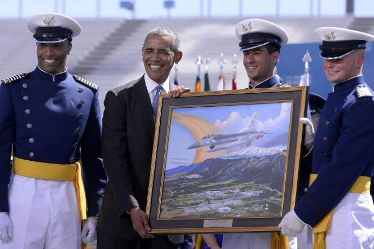 US President Barack Obama receives a gift from the U.S. Air Force Academy Class of 2016 at the U.S. Air Force Academy Class of 2016 at Falcon Stadium in Colorado Springs, Colorado, USA, 02 June, 2016. A US Air Force Thunderbird Jet crashed shortly after a flyover at the graduation but was able to eject and survived, reportedly meeting Obama at nearby Peterson Air Force Base. EPA/BILL EVANS / USAF / HANDOUT