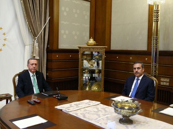 Turkish President Tayyip Erdogan (L) meets with Hakan Fidan, chief of the intelligence agency, at the Presidential Palace in Ankara, Turkey, July 22, 2016. Kayhan Ozer/Presidential Palace/Handout via REUTERS ATTENTION EDITORS - THIS PICTURE WAS PROVIDED BY A THIRD PARTY. FOR EDITORIAL USE ONLY. NO RESALES. NO ARCHIVE.