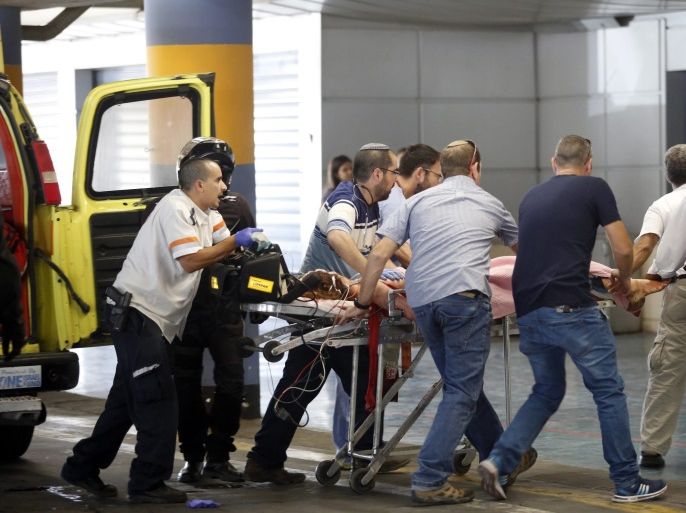 Emergency teams handle a wounded Israeli at the Shaare Zedek Medical Center in Jerusalem, Israel, 30 June 2016, following a shooting attack. Local media reported that Palestinian gun men opened fire at the Jewish settlement of Kryat Arba near the West Bank city of Hebron. Two Israelis were seriously injured and the attacker was shot dead by an armed settler,