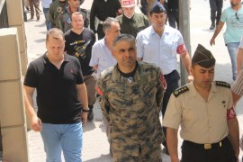 General Bekir Ercan Van (C), commander of the Incirlik air base, is taken to a courthouse in Adana, Turkey, July 17, 2016. Ihlas News Agency/Fatik Kece/via REUTERS ATTENTION EDITORS - THIS PICTURE WAS PROVIDED BY A THIRD PARTY. FOR EDITORIAL USE ONLY. NO RESALES. NO ARCHIVE. TURKEY OUT. NO COMMERCIAL OR EDITORIAL SALES IN TURKEY.