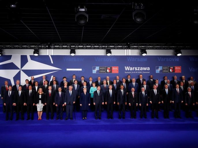 NATO heads of state and other leaders participate in a family photo at the NATO Summit in Warsaw, Poland July 8, 2016. REUTERS/Jonathan Ernst