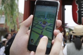 A Japanese Pokemon fan plays the newly released Pokemon Go hit-mobile game by Japanese videogame company Nintendo in front of Kaminarimon, the socalled Thunder Gate of the Buddhist Senso-ji temple, in Tokyo's downtown Asakura district, Japan, 22 July 2016. The game which was released in Japan on 22 July and uses GPS to locate the smartphone's position, has gained a huge popularity among smartphone users and added to the value of Nintendo that partly owns the franchise enterprise that makes Pokemon. Japanese government has issued a warning to use this game. Nintendo stock share continues to rise with McDonald Japan after the releasement.