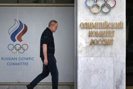 A man walks in front of the Russian Olympic Committee headquarters and Russian Athletics Federation office in Moscow, Russia, 19 July 2016. A World Anti-Doping Agency (Wada) Executive Committee meeting was held in Toronto, Canada on 18 July 2016 to discuss the McLaren Investigation Report which stated Russia operated a state-sponsored doping programme for four years across the 'vast majority' of summer and winter Olympic sports.