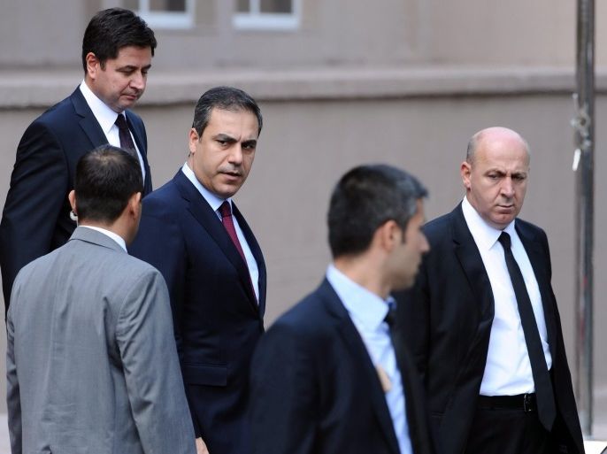 A picture made available on 07 February 2015 of the head of Turkey's intelligence service, Hakan Fidan (C) in front of the Turkish Prime Minister building, in Ankara, Turkey, 13 August 2012. Hakan Fidan, Turkey's intelligence chief and a close confidant of President Recep Tayyip Erdogan, has resigned from his post in order to be eligible to run in parliamentary elections later this year, the state-run Anadolu news agency reported 07 February 2015. His name has been mentioned in local media reports as a potential foreign minister candidate in the next government, which will be decided in elections slated for June.