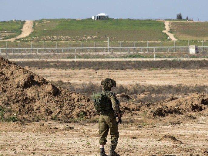 An Israeli soldier patrols near the Gaza Strip border with Israel, near the community of Nir Am, 03 February 2016. Israel is developing 'tunnel busting' technology near here and has protection from the Israeli army who patrol and keep watch over the Gaza Strip.