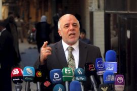 Iraqi Prime Minister Haider al-Abadi speaks at a news conference during his visit to Najaf, south of Baghdad, in this file photo taken October 20, 2014. The U.S. and Iran have formed an unlikely tacit alliance behind Iraq's prime minister as he challenges the ruling elite with plans for a non-political cabinet to fight corruption undermining the OPEC nation's economic and political stability. Local calls for Haider al-Abadi's removal -- including one by his predecessor as prime minister al-Maliki -- had been growing as he pursued a reshuffle aimed at addressing graft, which became a major issue after oil prices collapsed in 2014 and strained the government's finances as it launched a costly campaign against Islamic State. REUTERS/Alaa Al-Marjani /Files TPX IMAGES OF THE DAY