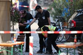 epa05439880 Police officers operate on a scene following an explosion in Ansbach, Germany, 25 July 2016. A man was killed and 12 others were injured in an explosion in Franconia Ansbach late on 24 July. According to media reports, a migrant from Syria tried to enter in to a music festival nearby and after he was denied entry into the venue, detonated a device in his backpack in front of a restaurant. The suspect died in the explosion. Around 2,500 people were evacuated from the venue of the festival. EPA/DANIEL KARMANN