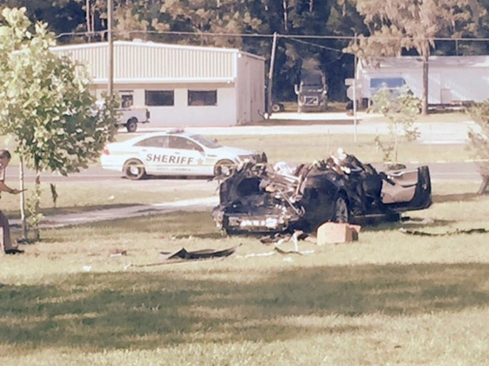 A Tesla Model S involved in the fatal crash on May 7, 2016 is shown with the top third of the car sheared off by the impact of the collision of the Tesla with a tractor-trailer truck on nearby highway and came to rest in the yard of Robert and Chrissy VanKavelaar in Williston, Florida, U.S. on May 7, 2016. Courtesy Robert VanKavelaar/Handout via REUTERS ATTENTION EDITORS - THIS IMAGE WAS PROVIDED BY A THIRD PARTY. EDITORIAL USE ONLY. THIS PICTURE WAS PROCESSED BY REUTE