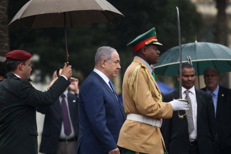 Israeli Prime Minister Benjamin Netanyahu walks to inspect a guard of honor at the National Palace during his State visit to Addis Ababa, Ethiopia, July 7, 2016. REUTERS/Tiksa Negeri