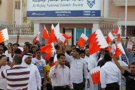 Anti-government protesters shout slogans while holding Bahraini flags during a protest outside Bahrain's leading opposition party Al Wefaq's headquarters in Manama in this file photo taken on May 9, 2012. A Bahraini court ordered the suspension of the main opposition group al-Wefaq and closed down its offices on June 14, 2016. REUTERS/Hamad I Mohammed