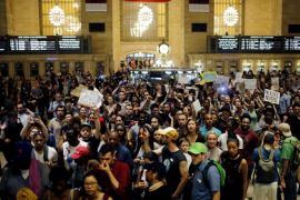 People go into Grand Central Station while they take part in a protest against the killing of Alton Sterling, Philando Castile and in support of Black Lives Matter during a march along Manhattan's streets in New York July 8, 2016. REUTERS/Eduardo Munoz