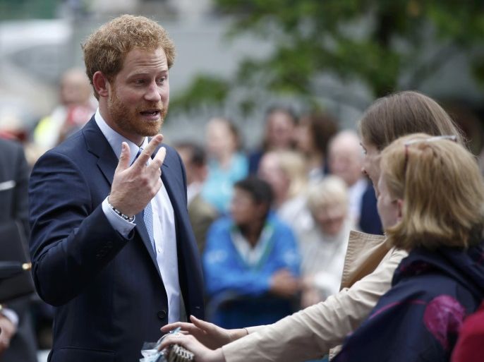 Britain's Prince Harry greets guests on the Mall as they attend the Patron's Lunch, an event to mark Queen Elizabeth's 90th birthday, in London, June 12, 2016. REUTERS/Peter Nicholls