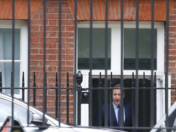 Britain's Prime Minister, David Cameron leaves through a rear entrance after a cabinet meeting at number 10 Downing Street, in central London, Britain July 12, 2016. REUTERS/Paul Hackett