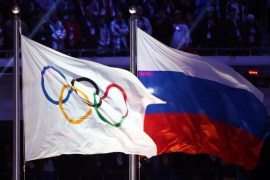 (FILE) A file picture dated 23 February 2014 of the Olympic flag (L) and the Russian flag (R) during the Closing Ceremony of the Sochi 2014 Olympic Games in the Fisht Olympic Stadium in Sochi, Russia. The ruling athletics body IAAF Council meets on 13 November 2015 to discuss a recommendation from an independent commission of the World Anti-Doping Agency (WADA) to suspend Russia from events including the 2016 Summer Olympics in Rio de Janeiro, because of wide-spread doping practices and cover-ups of positive tests, allegations first made in a German television documentary. EPA/HANNIBAL HANSCHKE *** Local Caption *** 51254472