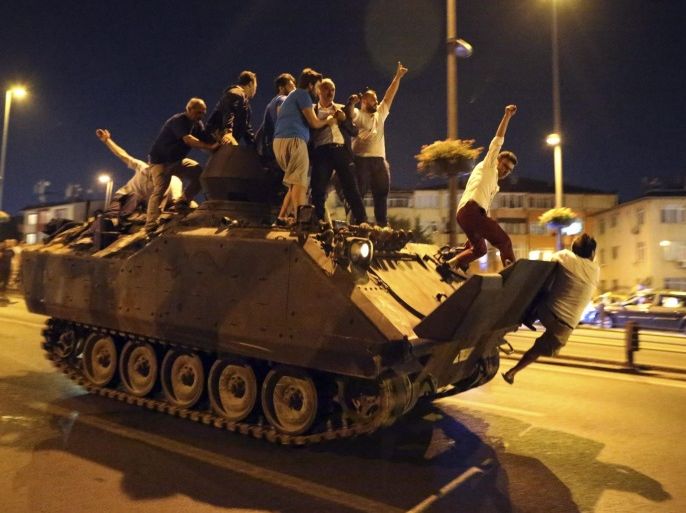 People occupy a tank in Istanbul, Turkey, 16 July 2016. Turkish Prime Minister Yildirim reportedly said that the Turkish military was involved in an attempted coup d'etat. The Turkish military meanwhile stated it had taken over control.