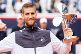 Martin Klizan from Slovakia celebrates with his trophy after winning the final match for the ATP-Tour German Tennis Championships in Hamburg, Germany, 16 July 2016.