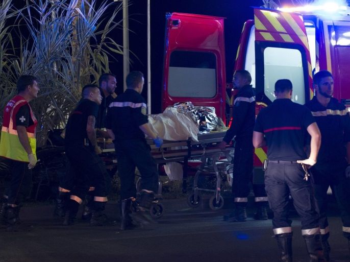 Wounded people are evacuated from the scene where a truck crashed into the crowd during the Bastille Day celebrations in Nice, France, 14 July 2016. According to reports, at least 70 people died and many were wounded after a truck drove into the crowd on the famous Promenade des Anglais during celebrations of Bastille Day. Anti-terrorism police took over the investigation in the incident, media added.