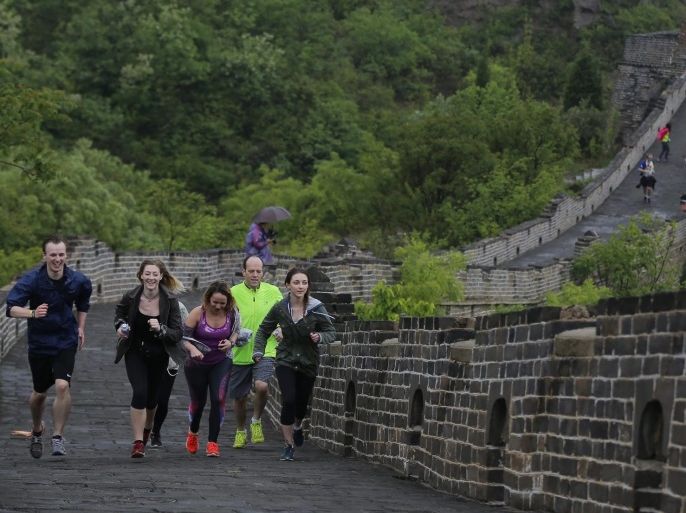 Participants run on the Simatai Great Wall during the Great Wall run festival in Beijing city, China, 14 May 2016. Several people attended the run event to finish the 05 kilometers route around and on the Simatai Great Wall and also took part in the music festival party to celebrated after the run festival.