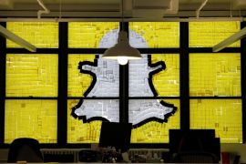 An image of the Snapchat logo created with Post-it notes is seen in the windows of Havas Worldwide at 200 Hudson Street in lower Manhattan, New York, U.S., May 18, 2016, where advertising agencies and other companies have started what is being called a "Post-it note war" with employees creating colorful images in their windows with Post-it notes. REUTERS/Mike Segar