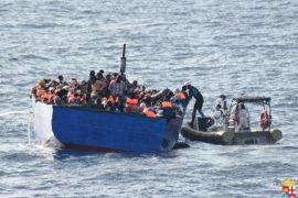 Migrants sit in their boat during a rescue operation by Italian navy ship Borsini (unseen) off the coast of Sicily, Italy, in this handout picture courtesy of the Italian Marina Militare released July 19, 2016. Marina Militare/Handout via REUTERS ATTENTION EDITORS - THIS PICTURE WAS PROVIDED BY A THIRD PARTY. FOR EDITORIAL USE ONLY. NO RESALES. NO ARCHIVES.