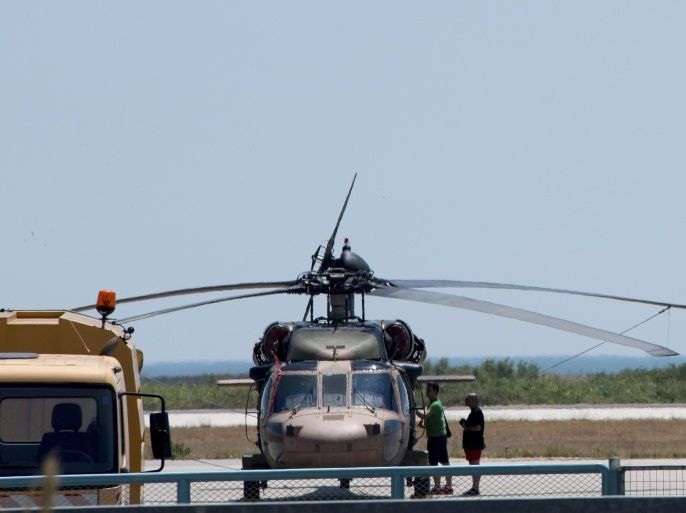 A Turkish military helicopter Black Hawk is seen at Dimokritos Airport of Alexandoupolis, northern Greece, 16 July 2016. The eight Turkish military officers that were on board the helicopter that landed in the early hours at Alexandroupolis airport sought political asylum in Greece. The Greek General Staff in an announcement on the landing of the Turkish Black Hawk helicopter on Saturday at 11:51 at Alexandroupolis airport said 'we inform you that the Black Hawk helicopter immediate return to Turkey is being planned while the responsible authorities for asylum will examine the helicopter passengers' request for political asylum in Greece'. Turkish Prime Minister Yildirim reportedly said that the Turkish military was involved in an attempted coup d'etat. According to news reports, Turkish President Recep Tayyip Erdogan has denounced the coup attempt as an 'act of treason' and insisted his government remains in charge.