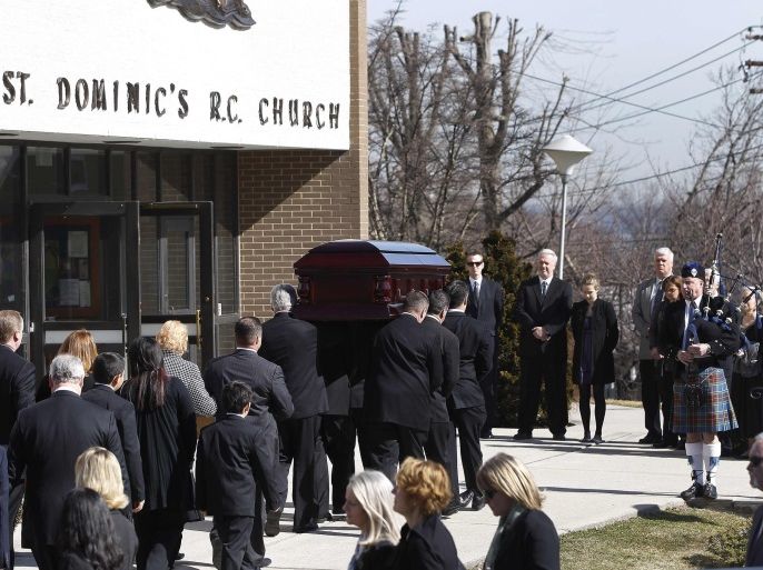The casket of journalist Marie Colvin is carried into her funeral service at St. Dominic's Church in Oyster Bay, New York, March 12, 2012. Colvin's final dispatch, published just three days before she and a French photographer were killed by shell and rocket fire, came from a bleak cellar packed with women and children cowering in the besieged Syrian city of Homs.