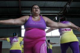 A woman takes part in an aerobics class in Los Guidos de Desamparados July 23, 2015. More than 300 women participated in a physical health program organized by Andrea Abarca, which aims to combat obesity and sedentary behavior in poor women living in a slum. The National Nutrition Survey shows that the Costa Rican population has 62.4 percent of adult men who are obese , while among women the percentage was 77.3, according to local media. REUTERS/Juan Carlos Ulate
