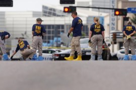 Members of the FBI Evidence Response Team survey the crime scene two days after a lone gunman ambushed and killed five police officers at a protest decrying police shootings of black men, in Dallas, Texas, U.S., July 9, 2016. REUTERS/Shannon Stapleton