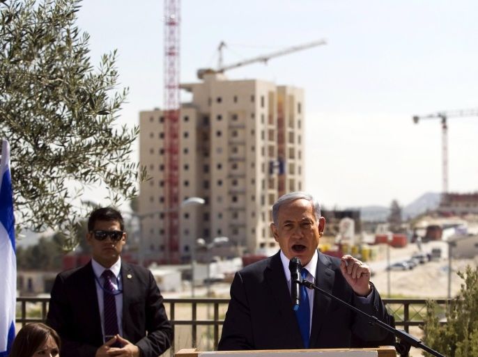 Israel's Prime Minister Benjamin Netanyahu delivers a statement in front of new construction in the Jewish settlement known to Israelis as Har Homa and to Palestinians as Jabal Abu Ghneim, in an area of the West Bank that Israel captured in a 1967 war and annexed to the city of Jerusalem, in this March 16, 2015 file photo. A day before his surprise election victory last month, Netanyahu stood against the backdrop of a construction site in Har Homa, a towering settlemen