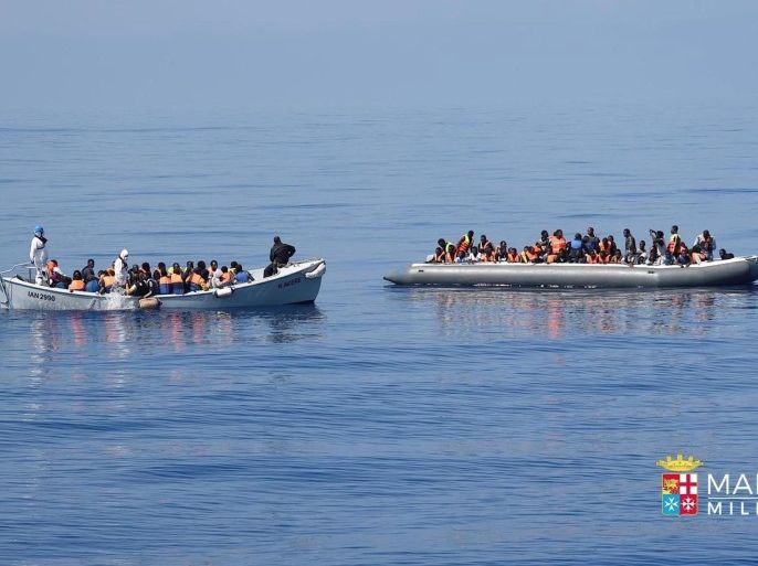 A handout image released by the Italian Navy on 06 July 2016 shows A Italy Marina Militare boat flanked rubber boat brings rescued migrants from a boat in distress at the Strait of Sicily to the Italyan Navy's ships Bettica, Aviere and Margottini in the Mediterranean Sea off the Italian coast on 05 July 2016. More than 4500 migrants were rescued form distress in the Mediterranean Sea in 30 seperate operations on 05 July 2016. EPA/MARINA MILITARE / HANDOUT