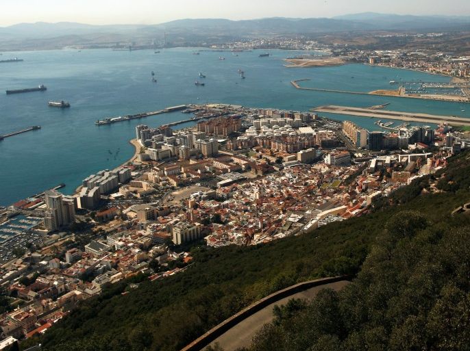 A general view of the British overseas territory of Gibraltar (bottom), the Spanish city of La Linea de la Concepcion (R) and Algeciras Bay are pictured from the Rock, a monolithic limestone promontory, in Gibraltar, south of Spain August 16, 2013. REUTERS/Jon Nazca/File Photo