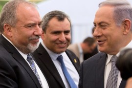 Israeli Prime Minister Benjamin Netanyahu (R) and Israel's defense minister, Avigdor Lieberman (L) during a special Cabinet meeting to mark Jerusalem Day in Ein Lavan Spring located in the outskirts of Jerusalem 02 June 2016. REUTERS/Abir Sultan/Pool