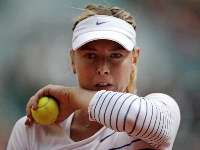 Maria Sharapova of Russia wipes her face during her women's singles match against Lucie Safarova of the Czech Republic during the French Open tennis tournament at the Roland Garros stadium in Paris, France, in this June 1, 2015 file picture. Russian tennis star Maria Sharapova, the highest-paid woman in sports, said on March 7, 2016 that she failed a drug test at the Australian Open due to a substance she has been taking for 10 years for health issues. Hours after the announcement, one of her biggest sponsors, Nike Inc., said it had suspended its relationship with her while the investigation continues, cable news channel CNBC reported. REUTERS/Gonzalo Fuentes/Files