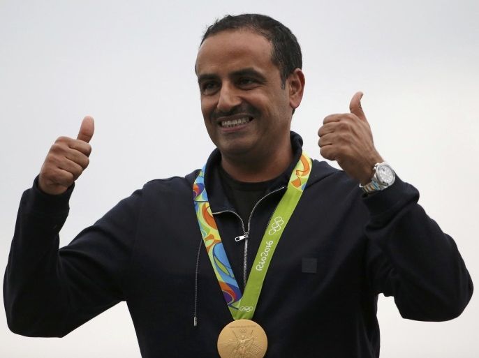2016 Rio Olympics - Shooting - Victory Ceremony - Men's Double Trap Victory Ceremony - Olympic Shooting Centre - Rio de Janeiro, Brazil - 10/08/2016. Fehaid Aldeehani (KUW) of Independent Olympic Athlete poses with his gold medal. REUTERS/Edgard Garrido FOR EDITORIAL USE ONLY. NOT FOR SALE FOR MARKETING OR ADVERTISING CAMPAIGNS.