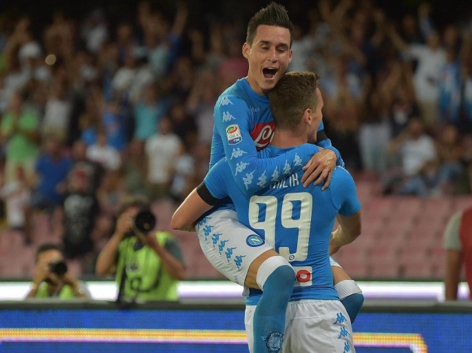 Napoli's Arkadiusz Milik (R) jubilates with his teammate Jose Callejon after scoring the goal during the Italian Serie A soccer match SSC Napoli vs AC Milan at San Paolo stadium in Naples, Italy, 27 August 2016.