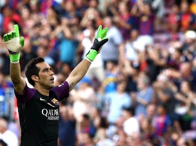 FC Barcelona's Chilean goalkeeper Claudio Bravo celebrates after his teammate Uruguayan Luis Suarez scored the team's second goal against Real Betis during their Primera Division league match at Camp Nou in Barcelona, northeastern Spain, 20 August 2016.