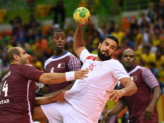 Tunisia's Marouan Chouiref (2R) in action with Qatar's Bassel Alrayes (L), Rafael Capote (2L) and Hassan Mabrouk (R) during their Rio 2016 Olympic Games men's Handball match at the Future Arena in the Olympic Park in Rio de Janeiro, Brazil, 11 August 2016.