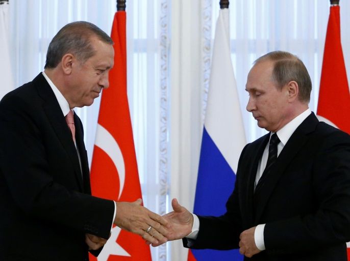 Russian President Vladimir Putin shakes hands with Turkish President Tayyip Erdogan during a news conference following their meeting in St. Petersburg, Russia, August 9, 2016. REUTERS/Sergei Karpukhin TPX IMAGES OF THE DAY