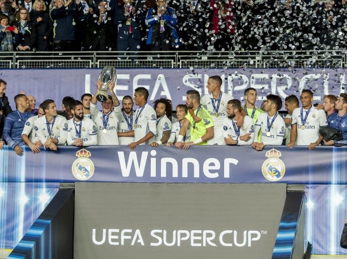 Real Madrid celebrate with the trophy after winning the UEFA Super Cup 2016 match between Real Madrid and FC Sevilla in Trondheim, Norway, 09 August 2016. EPA/Ned Alley NORWAY OUT